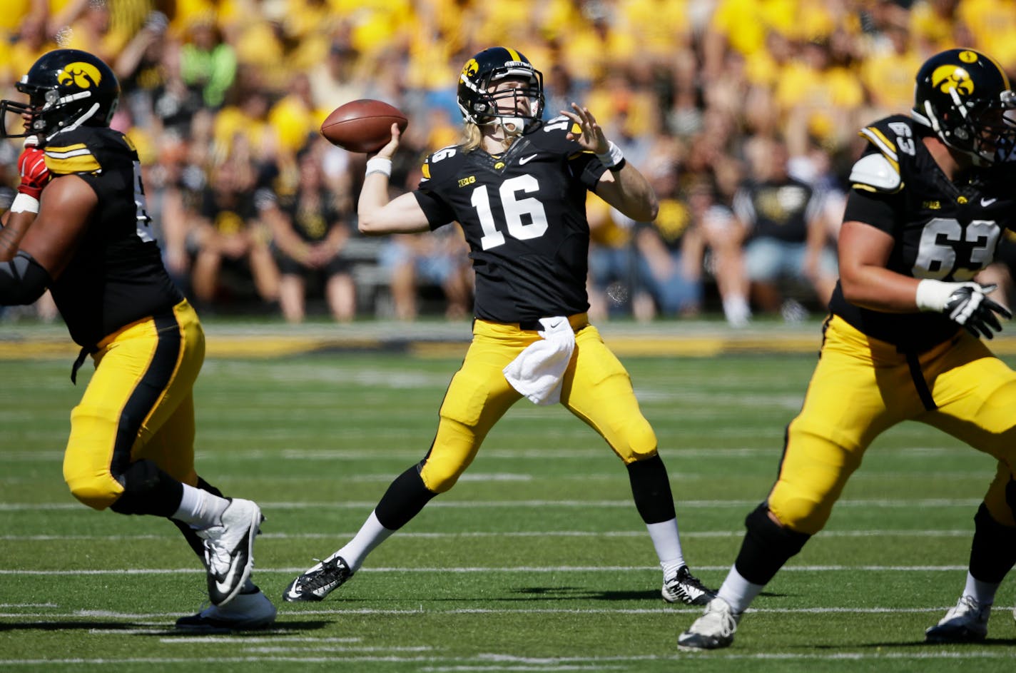 Iowa quarterback C.J. Beathard (16) throws a pass during the first half of an NCAA college football game against Ball State, Saturday, Sept. 6, 2014, in Iowa City, Iowa. (AP Photo/Charlie Neibergall)