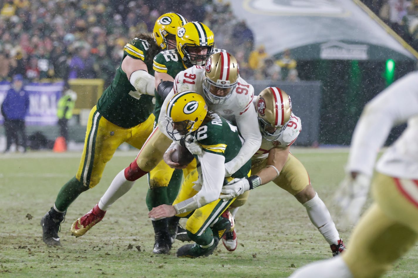 San Francisco 49ers' Arik Armstead sacks Green Bay Packers' Aaron Rodgers during the second half of an NFC divisional playoff NFL football game Saturday, Jan. 22, 2022, in Green Bay, Wis. (AP Photo/Matt Ludtke)