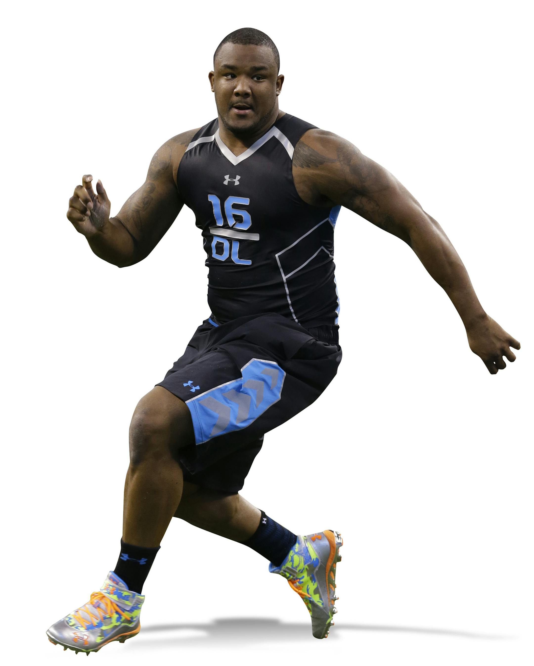 Minnesota defensive lineman Ra'Shede Hageman runs a drill at the NFL football scouting combine in Indianapolis, Monday, Feb. 24, 2014. (AP Photo/Michael Conroy) ORG XMIT: INMC10