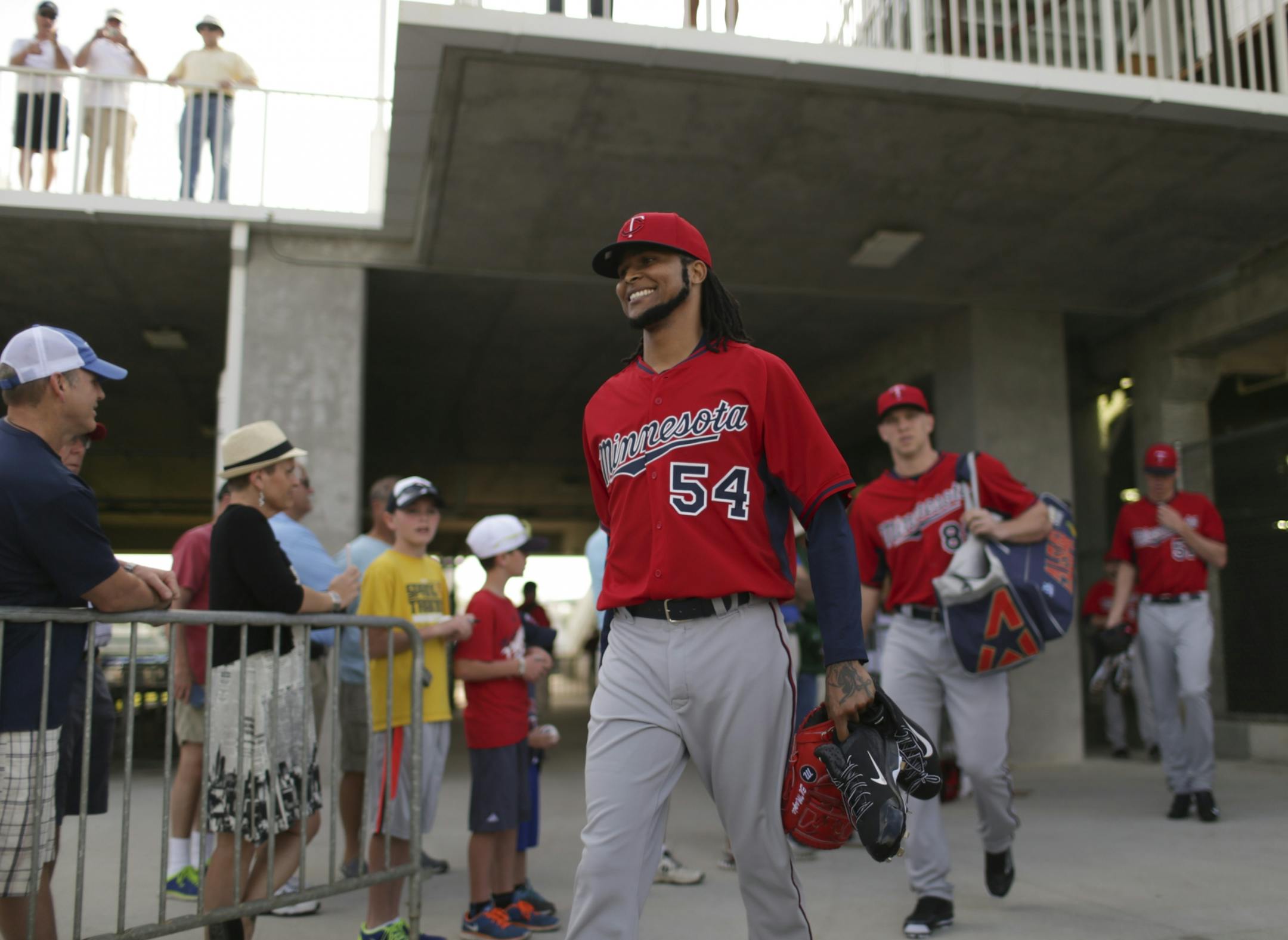 Twins pitcher Ervin Santana walked towards the field for the Twins' first workout Monday morning at Hammond Stadium.