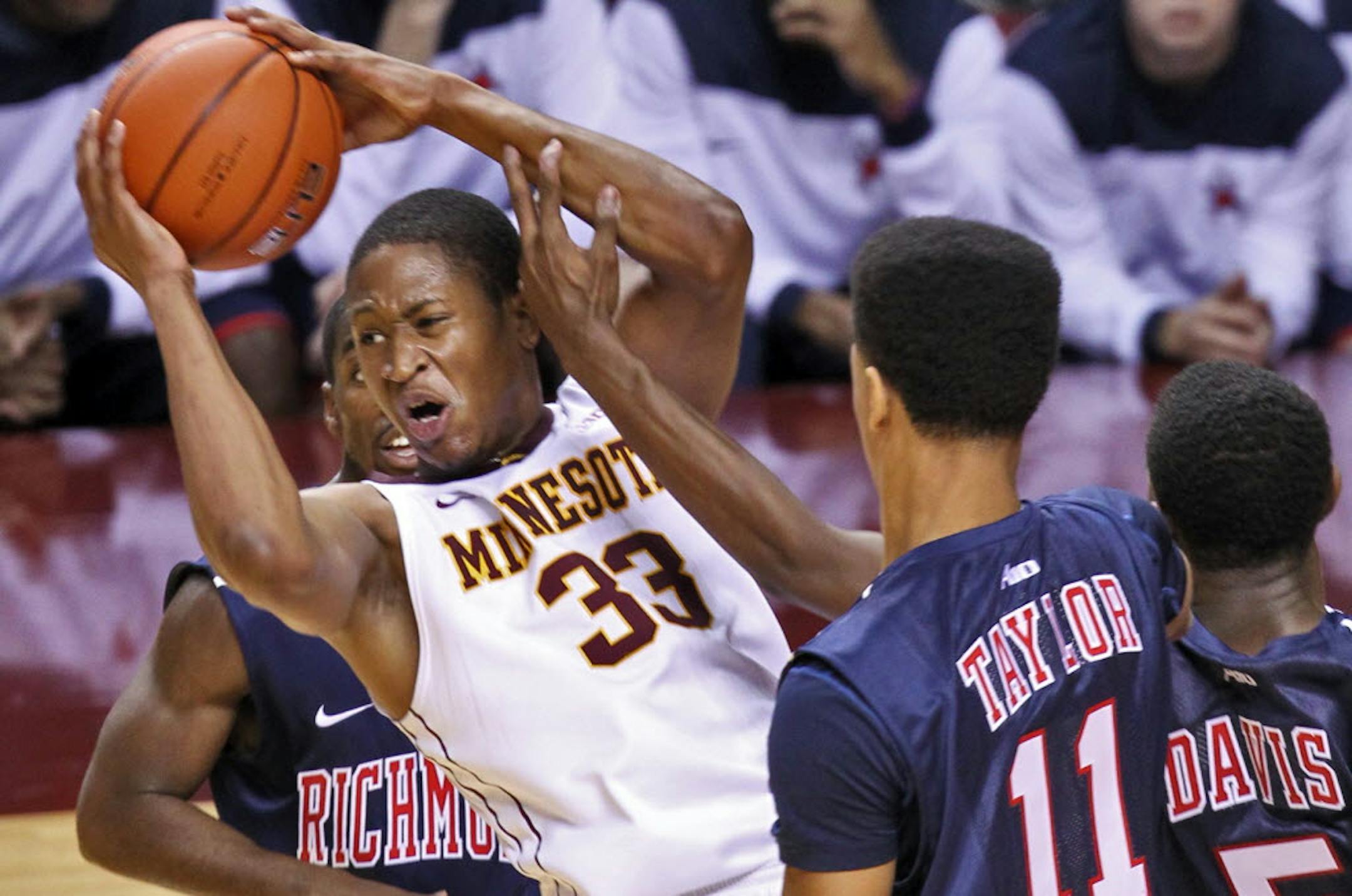 Gophers forward Rodney Williams pulled down a rebound in the midst of the Richmond defense Sunday.