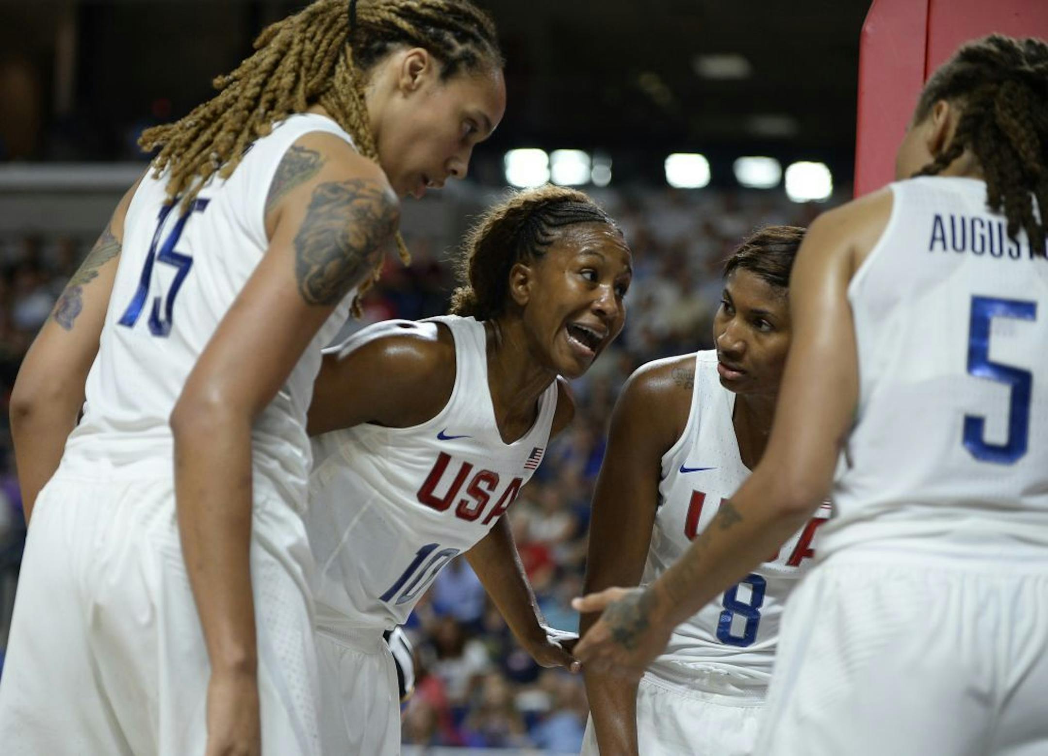United States' Tamika Catchings second from left, huddles with teammates Brittney Griner, left, Angel McCoughtry and Seimone Augustus, right, during the second half of an exhibition basketball game against Canada, Friday, July 29, 2016, in Bridgeport, Conn.