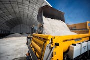 Workers with the Eagan Public Works Department prepared for another dump of weekend snow by filling trucks with salt, in March 2019. GLEN STUBBE • g