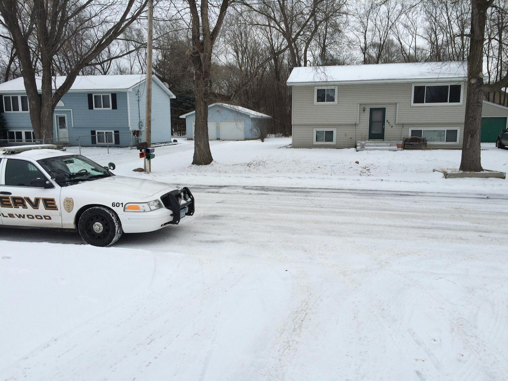 A police car on Friday was outside the Maplewood house, the tan one on the right, where an 18-month-old was found dead Thursday.