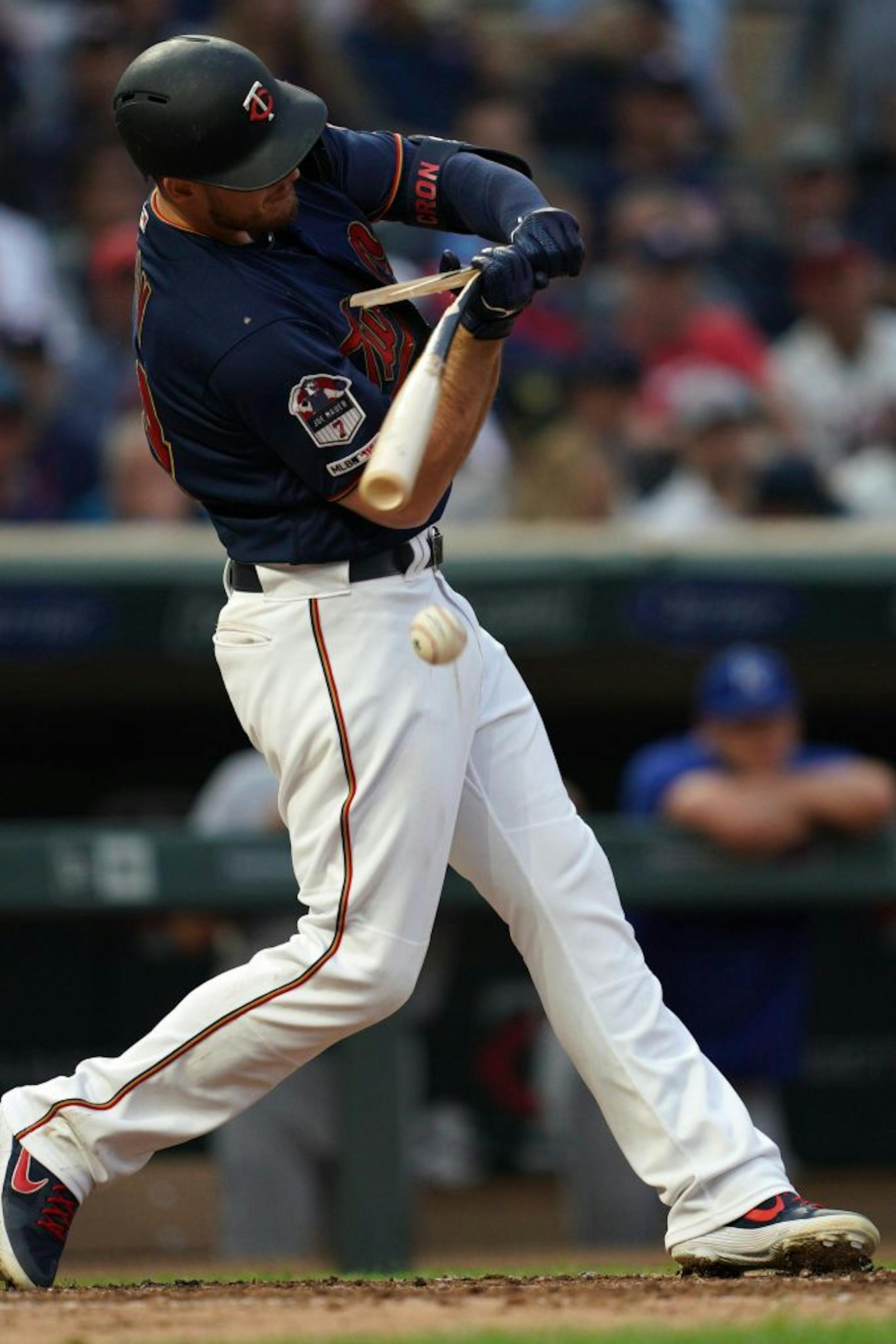 Minnesota Twins first baseman C.J. Cron (24) broke his bat as he connected with the ball in the fifth inning.