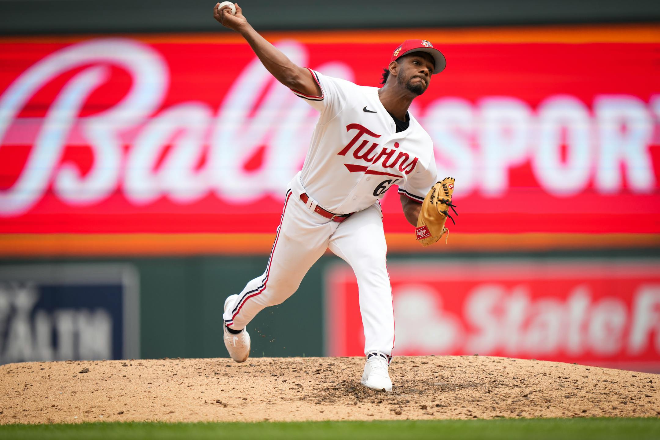 Minnesota Twins relief pitcher Oliver Ortega (62) pitches in the 8th inning.
