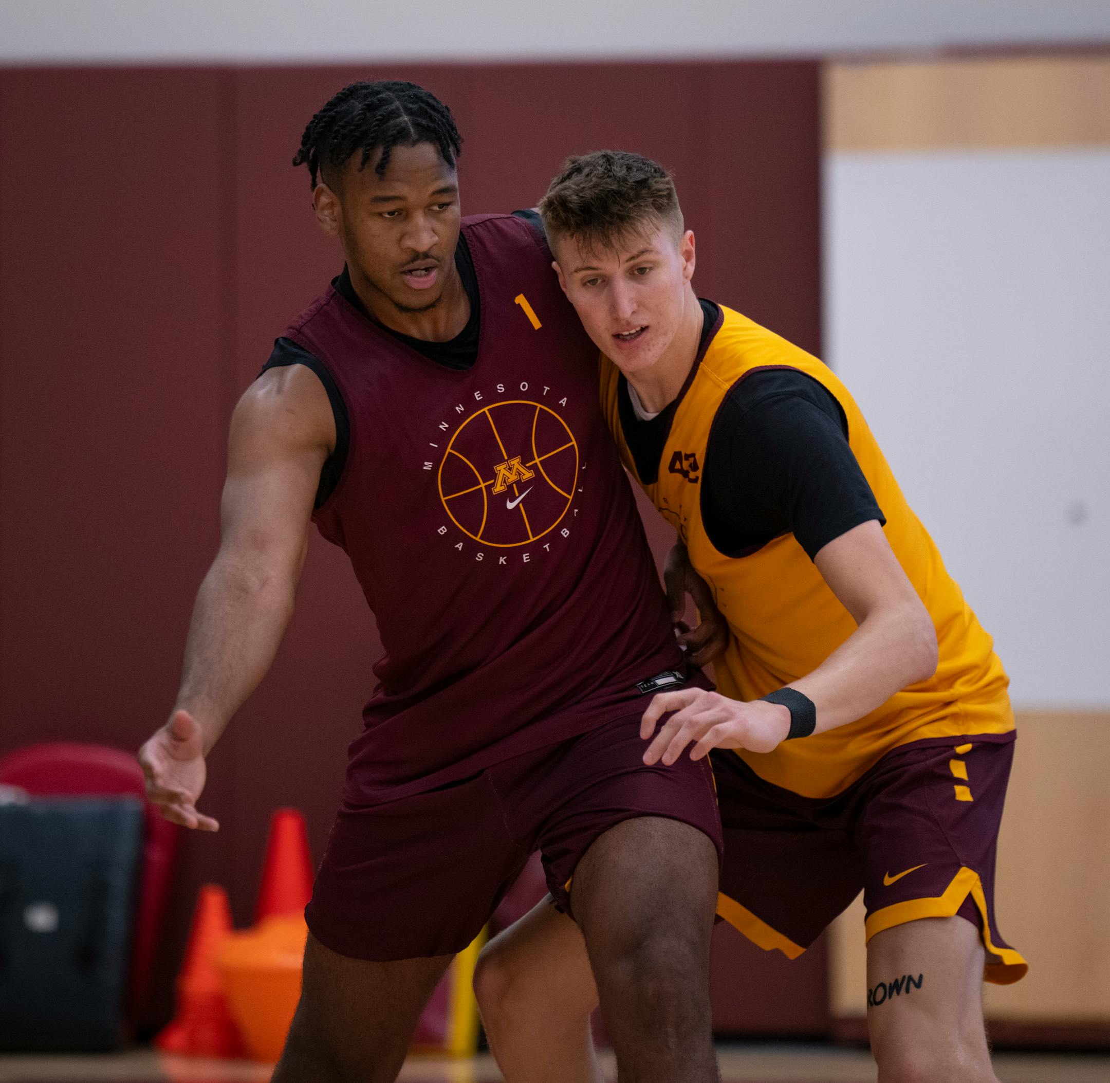 Forward Eric Curry (1) and center Treyton Thompson (42) took part in a drill at practice.