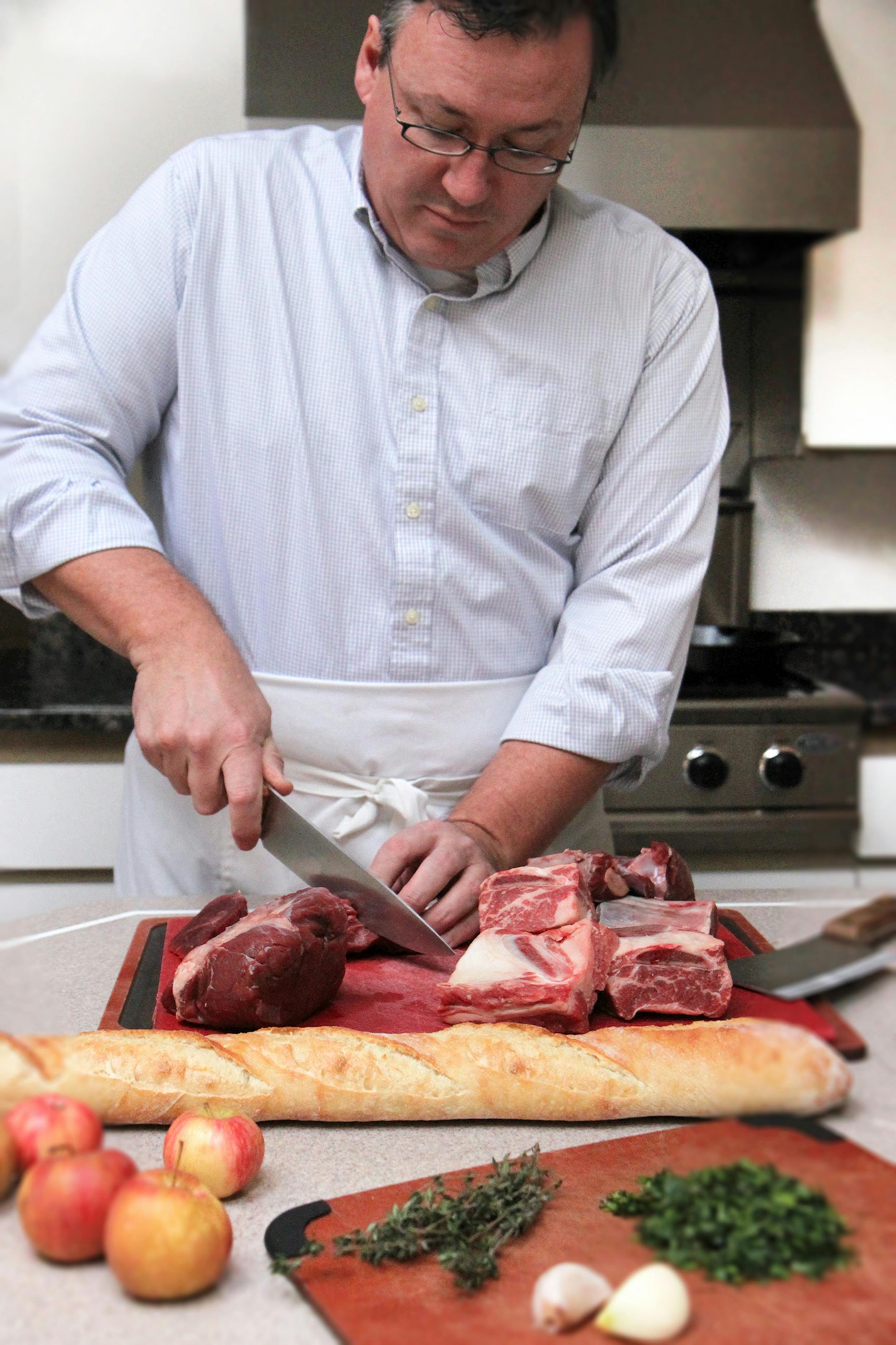Photo by Mary Jo Hoffman, Special to the Star Tribune Steve Hoffman cutting venision shoulder, for hunting story by Steve Hoffman.