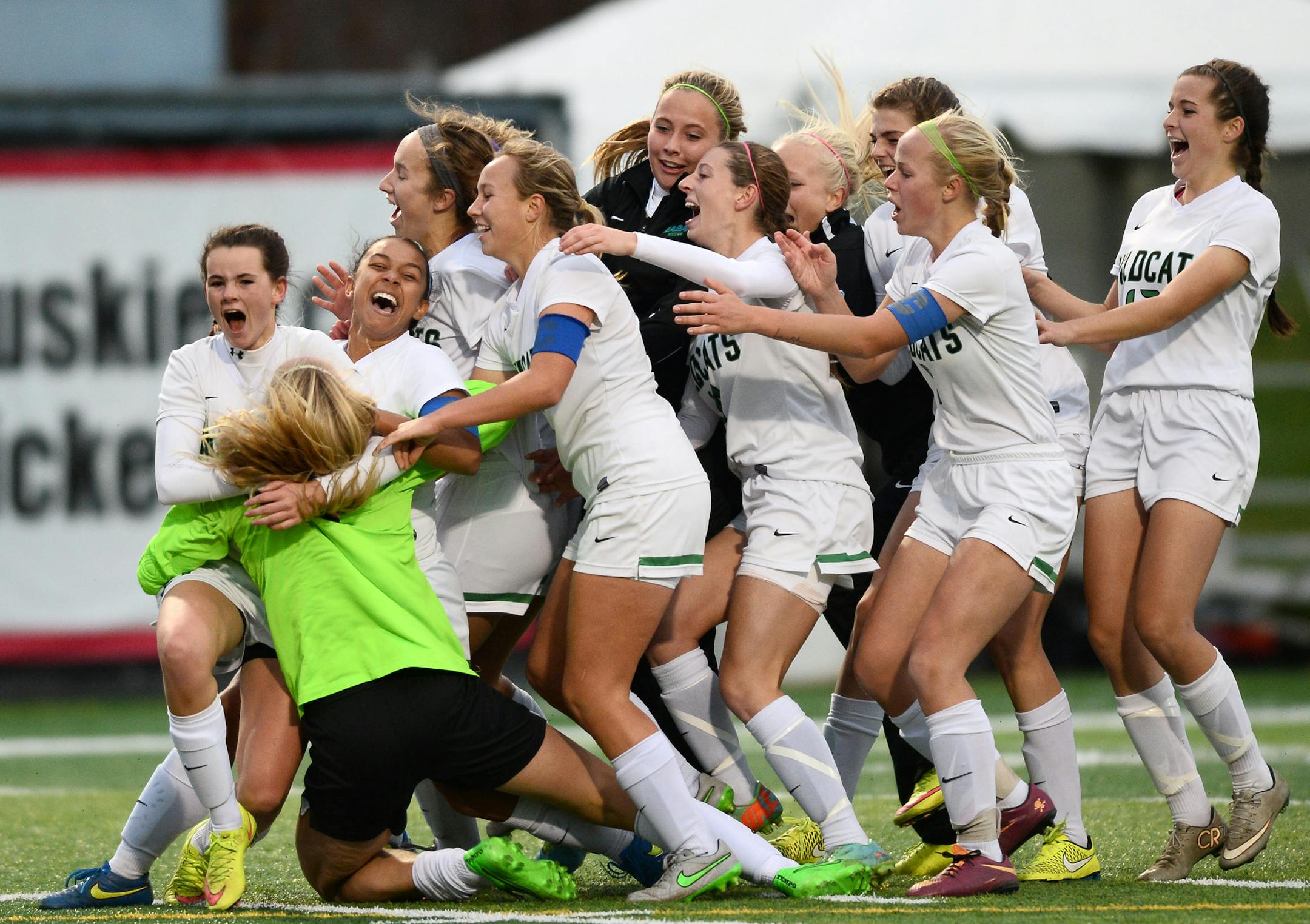 Eagan players celebrated with goalkeeper Megan Plaschko (0) after defeating Eden Prairie 1-0 in a 3-2 shootout Thursday night for the state championship. ] (AARON LAVINSKY/STAR TRIBUNE) aaron.lavinsky@startribune.com Eden Prairie played Eagan in the girls' 2A state championship game on Thursday, Nov. 5, 2015 at Husky Stadium at St. Cloud State University. Eagan won 1-0 over Eden Prairie after winning the shootout 3-2.