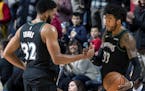 Karl-Anthony Towns and Jeff Teague celebrated at the end of the game. Minnesota beat Houston 103-91. ] CARLOS GONZALEZ &#xef; cgonzalez@startribune.co