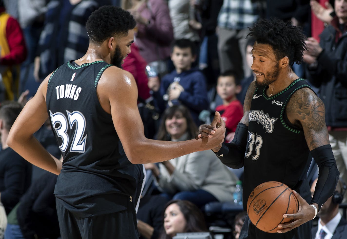 Karl-Anthony Towns and Jeff Teague celebrated at the end of the game. Minnesota beat Houston 103-91. ] CARLOS GONZALEZ &#xef; cgonzalez@startribune.com &#xf1; December 3, 2018, Minneapolis, MN, Target Center, NBA, Basketball, Minnesota Timberwolves vs. Houston Rockets