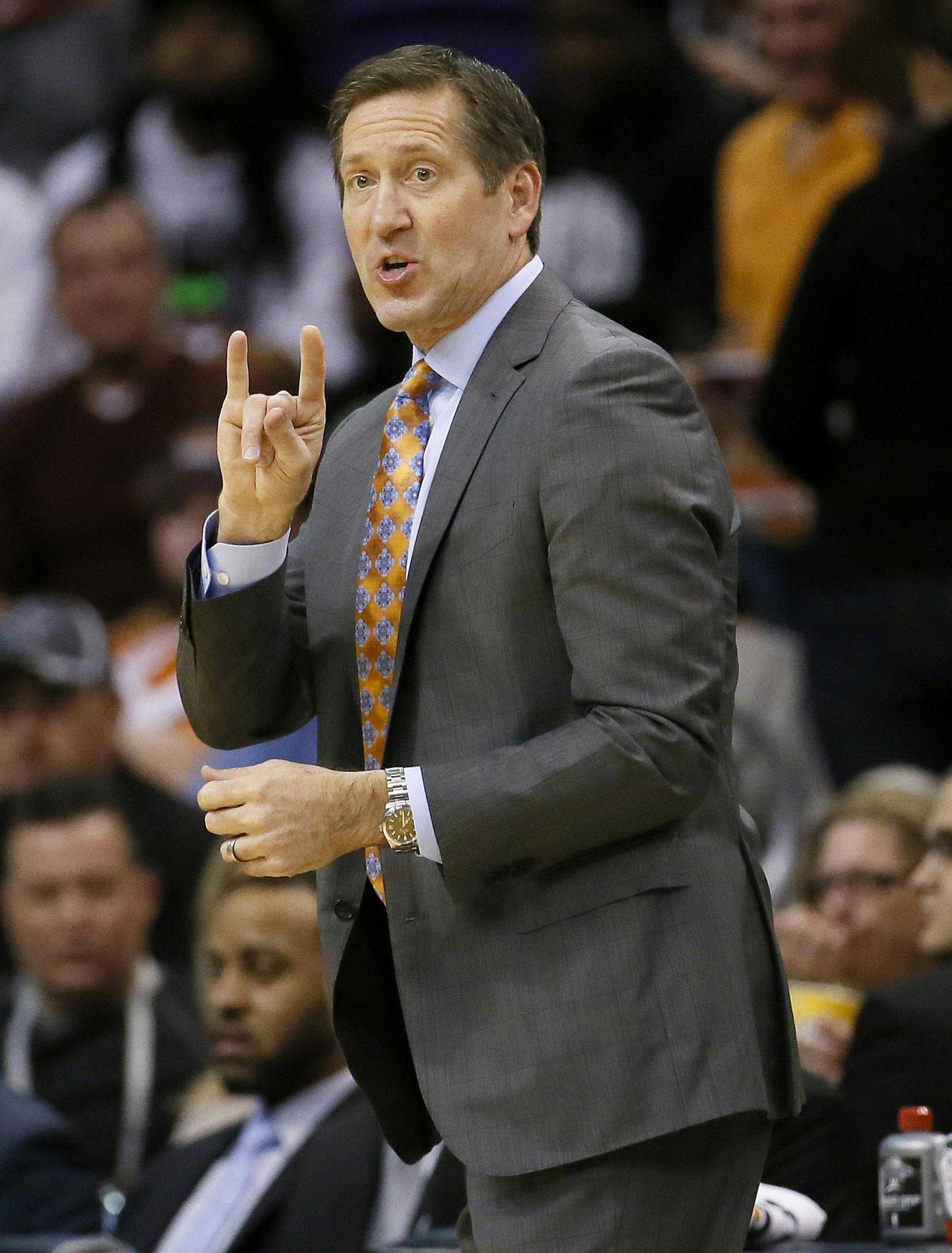 Phoenix Suns head coach Jeff Hornacek makes a call during the first half of an NBA basketball game against the Minnesota Timberwolves, Friday, Jan. 16, 2015, in Phoenix. (AP Photo/Matt York)