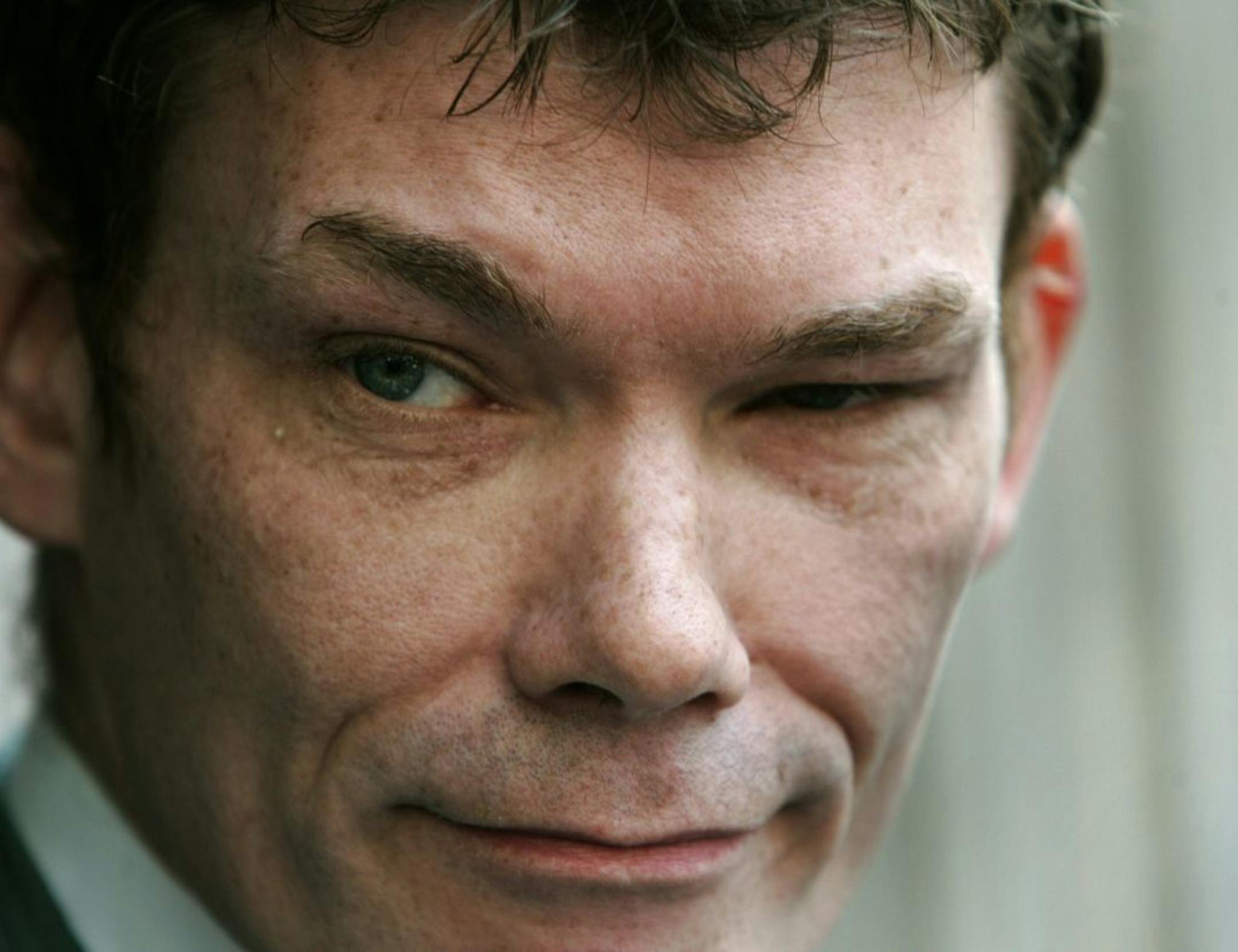 FILE - In this Wednesday May 10, 2006 file photo Gary McKinnon, accused of mounting the largest ever hack of United States government computer networks, listens to a reporter's question outside the Bow Magistrates Court in central London.