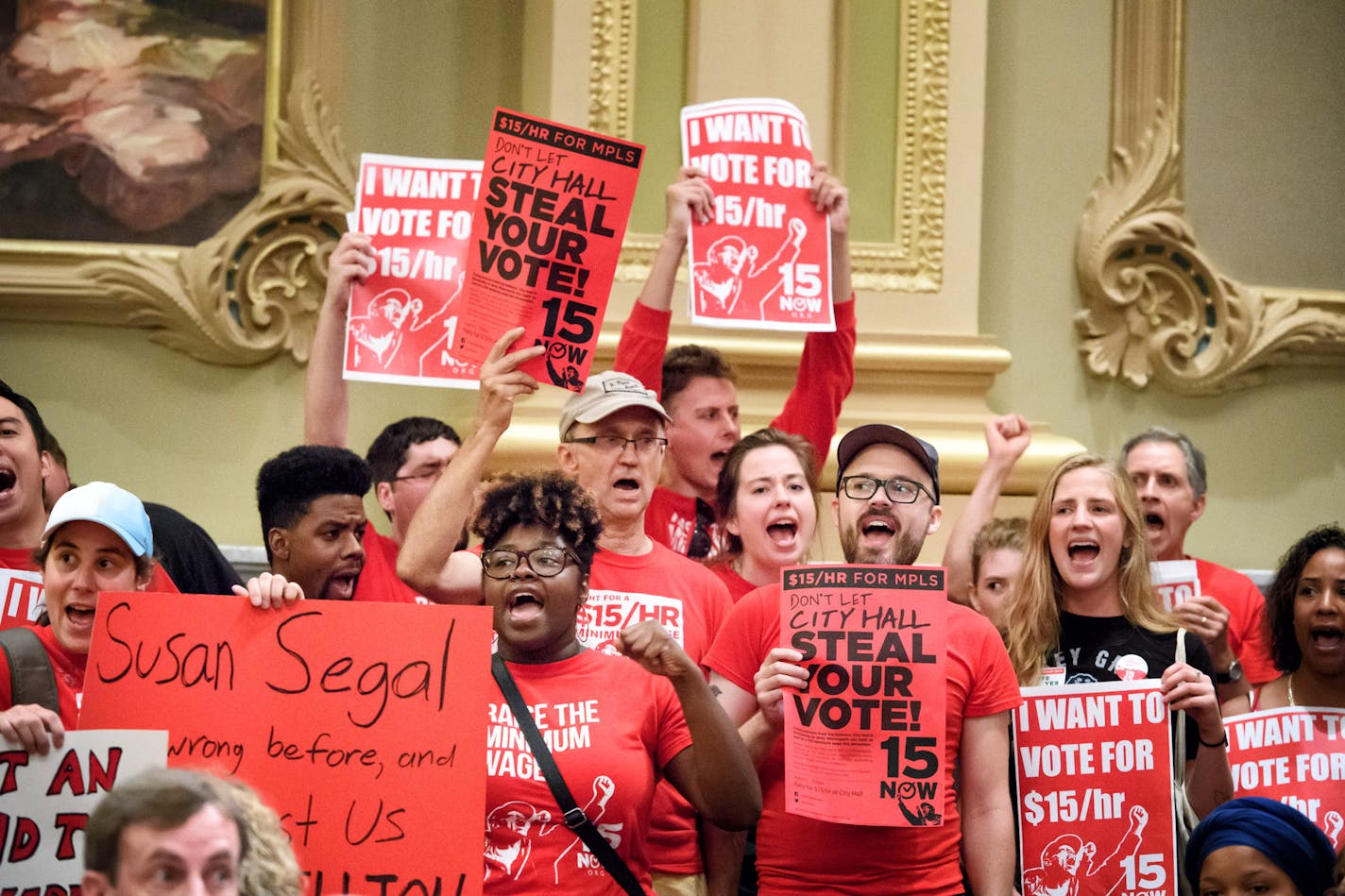 Members of 15 Now, NOC, CTUL and other groups trying to get a $15 minimum wage on the Minneapolis ballot this November chanted in Minneapolis City Council Chambers. ] GLEN STUBBE * gstubbe@startribune.com Wednesday, August 3, 2016 Members of 15 Now, NOC, CTUL and other groups trying to get a $15 minimum wage on the Minneapolis ballot this November gathered outside City Hall and marched together as a group into council chambers to press their demands.