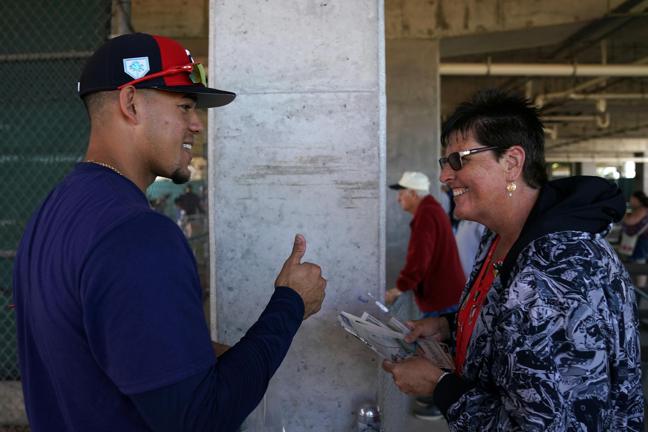 Twins pitcher Jose Berrios (17) gave a thumbs up to Dutch Johnson of Wabasha, Minn. as she gave him a group of newspaper clippings of himself after workouts at Hammond Stadium Thursday morning.