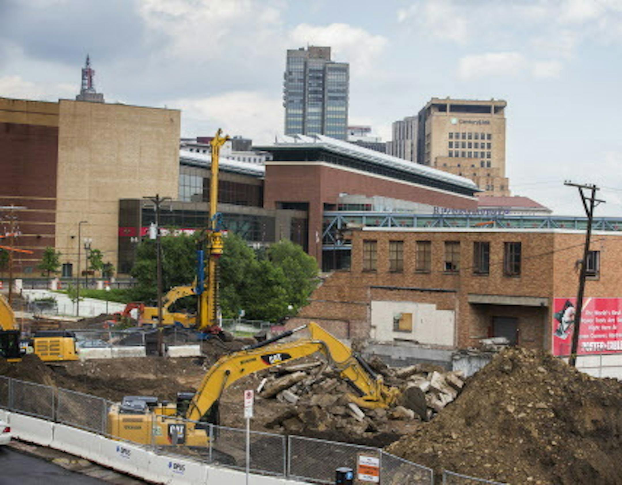 Crews work on the site of a demolition of an old hardware store and church to make way for new housing and retail development on West Seventh Street at Chestnut Street in St. Paul on Wednesday, June 17, 2015. ] LEILA NAVIDI leila.navidi@startribune.com / BACKGROUND INFORMATION: After years as one of St. Paul's biggest afterthoughts, West Seventh Street is on the cusp of a renaissance that could put it in league with Northeast in Minneapolis and nearby Lowertown in St. Paul as one of the metro ar
