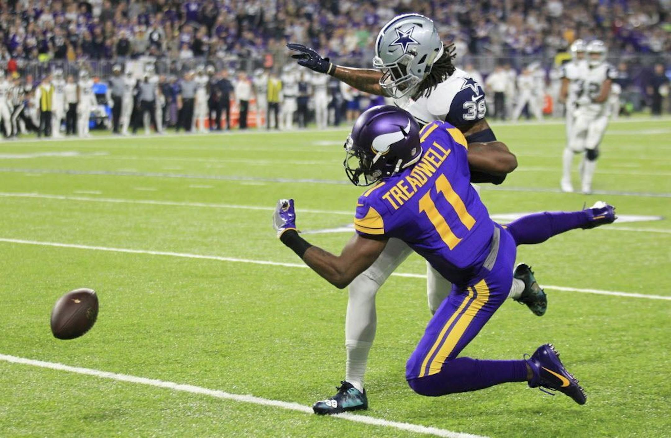 Dallas Cowboys cornerback Brandon Carr (39) breaks up a pass intended for Minnesota Vikings wide receiver Laquon Treadwell (11) during the second half of an NFL football game Thursday, Dec. 1, 2016, in Minneapolis.