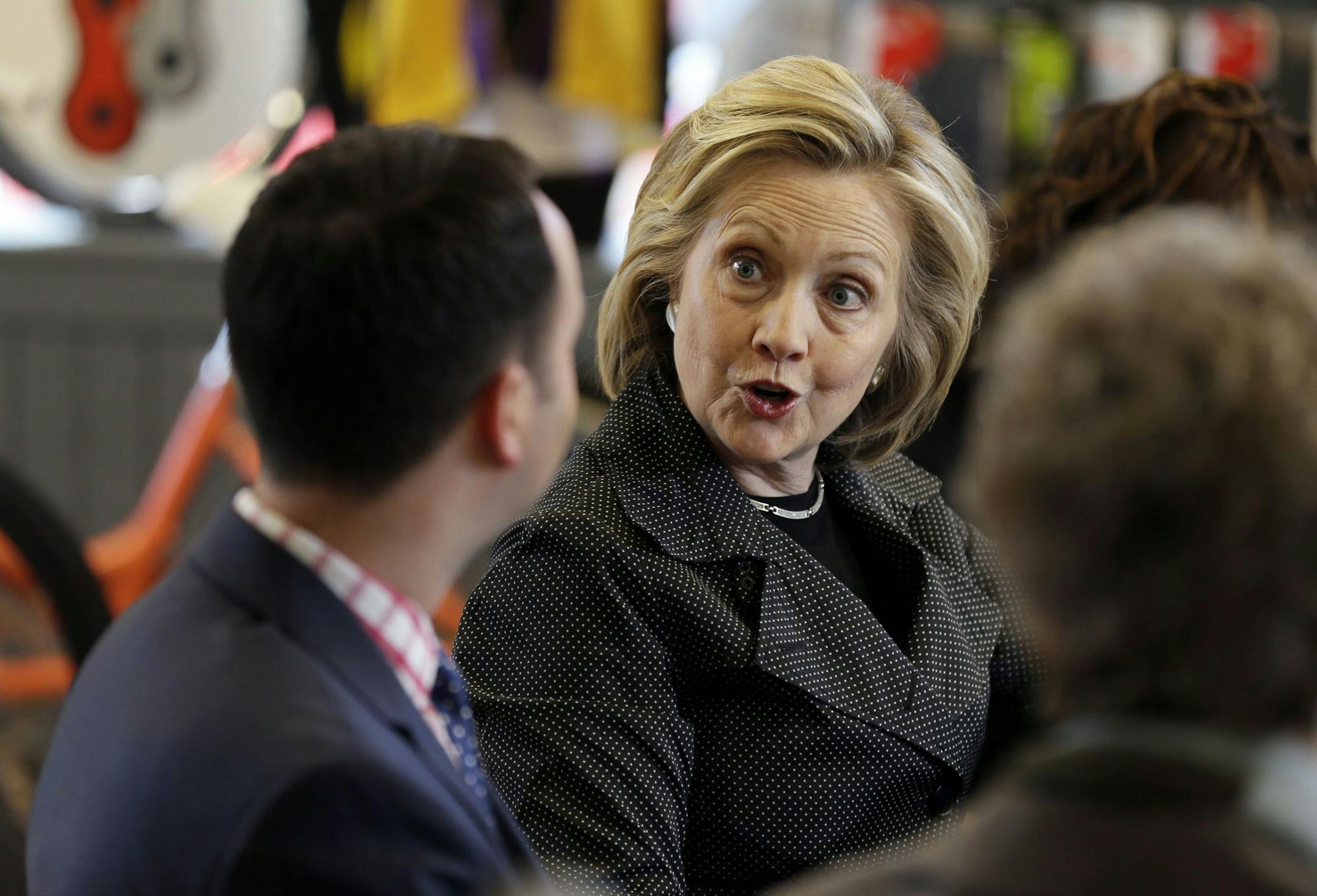Democratic presidential candidate Hillary Rodham Clinton talks to Brad Magg, left, owner of Goldieís Ice Cream Shoppe and Magg Family Catering, during a meeting with small business owners, Tuesday, May 19, 2015, at the Bike Tech cycling shop in Cedar Falls, Iowa. (AP Photo/Charlie Neibergall) ORG XMIT: IACN116