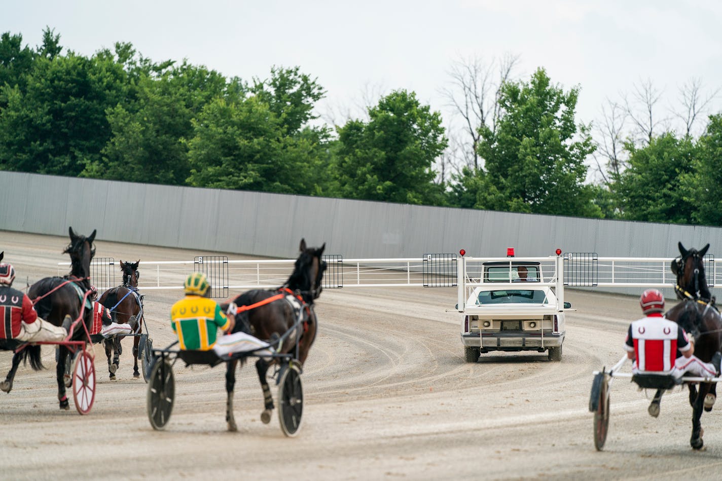 John and Sandy Betts run the starter's car during a harness race at Running Aces