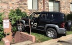 A woman crashed her Jeep Liberty into a Hopkins apartment building just before 10 a.m. Thursday, police said.