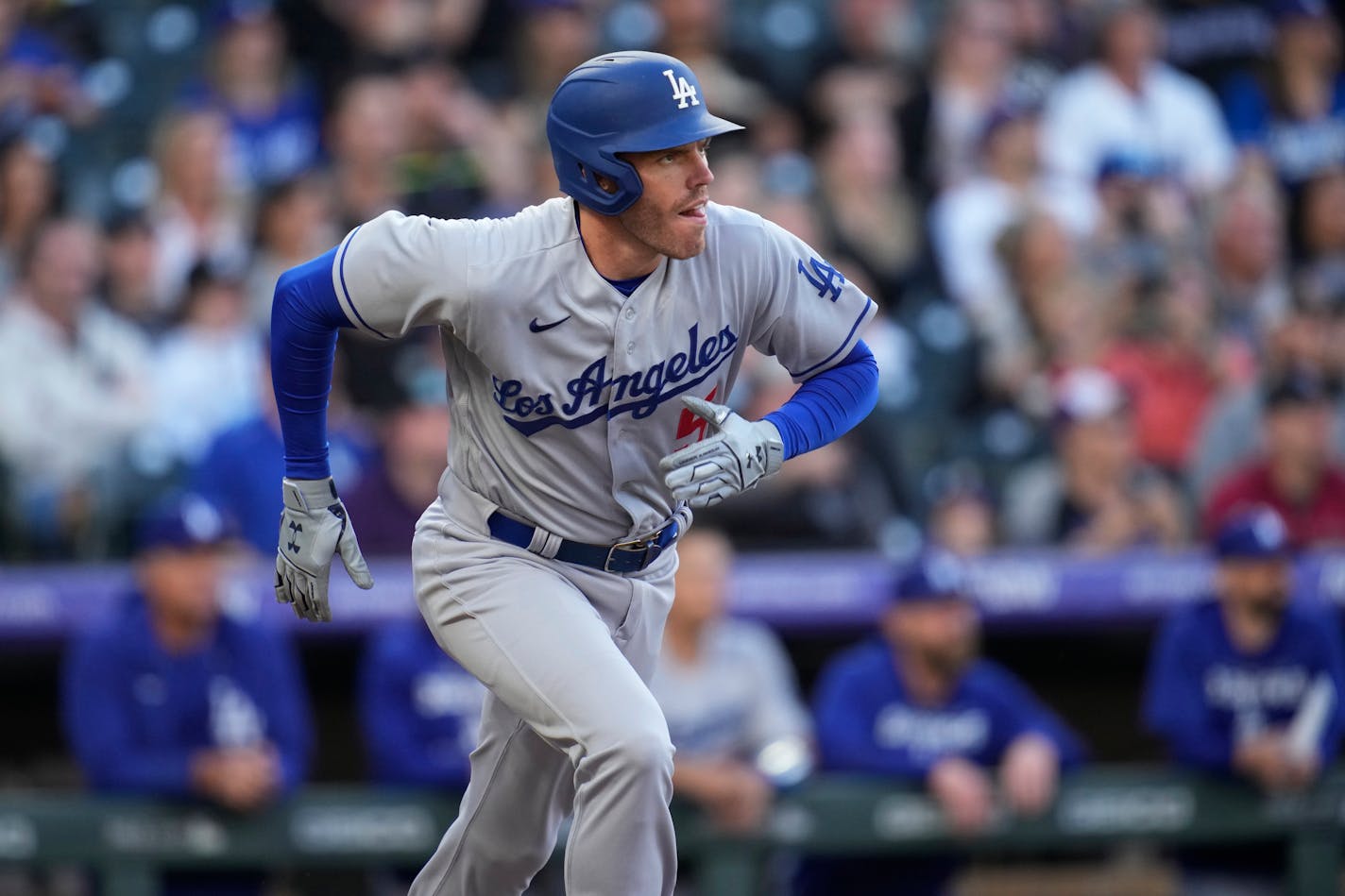 Los Angeles Dodgers' Freddie Freeman watches his fly-out against the Colorado Rockies during the first inning of a baseball game Saturday, April 9, 2022, in Denver. (AP Photo/David Zalubowski)