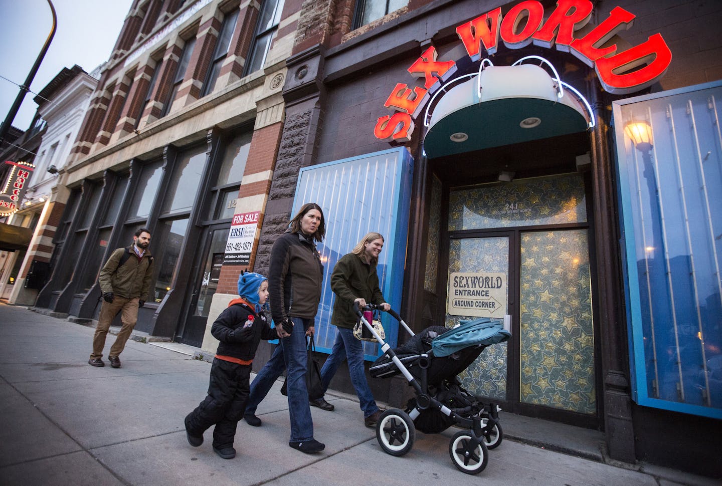 Laura and Daniel Mays, with Asher, 4, and 1-year-old twins Annika and Trygg, walked back to their North Loop condo from Whole Foods on Washington Avenue.