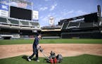 Grounds crew member Reid Olson, of Minnetonka, used a greens mower to cut the grass near second base Friday afternoon. ] Aaron Lavinsky &#x2022; aaron