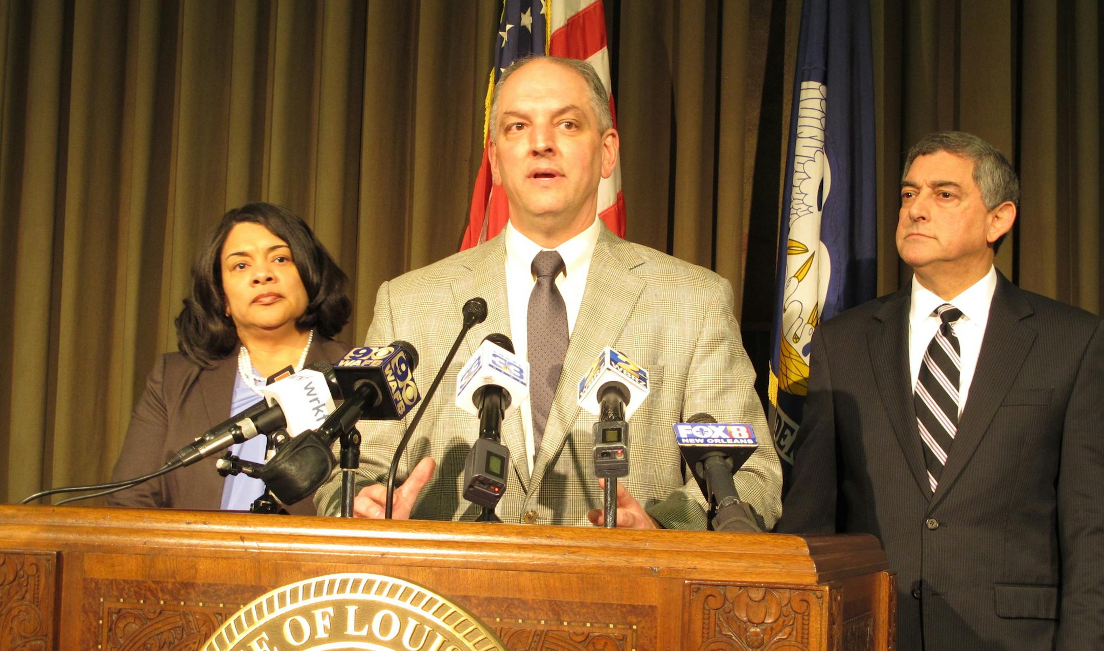 Louisiana Gov. John Bel Edwards, center, unveils his proposals for balancing Louisiana's budget, including a list of tax increases for legislative consideration, during a news conference, Tuesday, Jan. 19, 2016, in Baton Rouge, La. Joining Edwards are Revenue Secretary Kimberly Robinson, left, and Commissioner of Administration Jay Dardenne. (AP Photo/Melinda Deslatte)