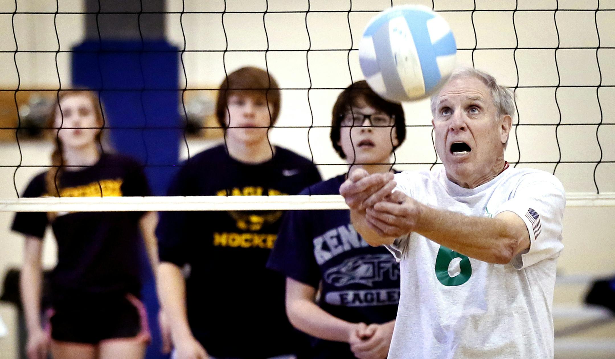 Bob Wandberg tried to hit the ball over the net during a volley ball game with Jefferson High students . A group of senior citizens who call themselves "Born Again Jocks" played volleyball with sophomore students at Kennedy High school Monday March 2, 2015 in Bloomington, Minnesota. The team includes seniors who have been selected to play in the upcoming Senior Olympics this summer.] Jerry Holt/ Jerry.Holt@Startribune.com