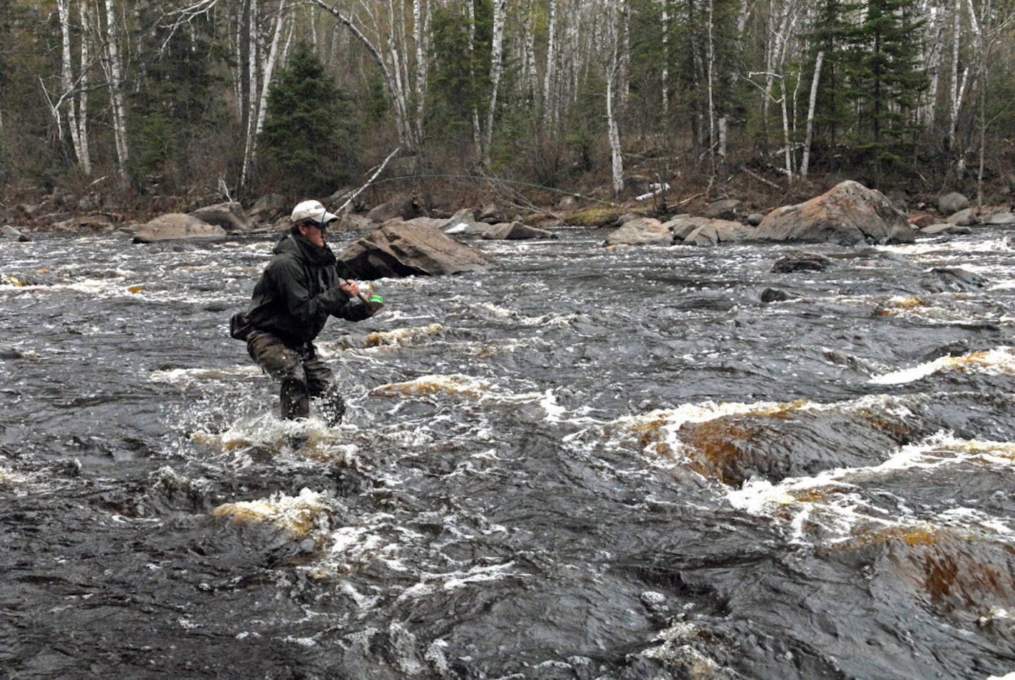 Fighting a big steelhead in a rocky, fast-moving North Shore river pits the angler's will — and equipment — against that of one of the world's strongest fish, pound for pound.