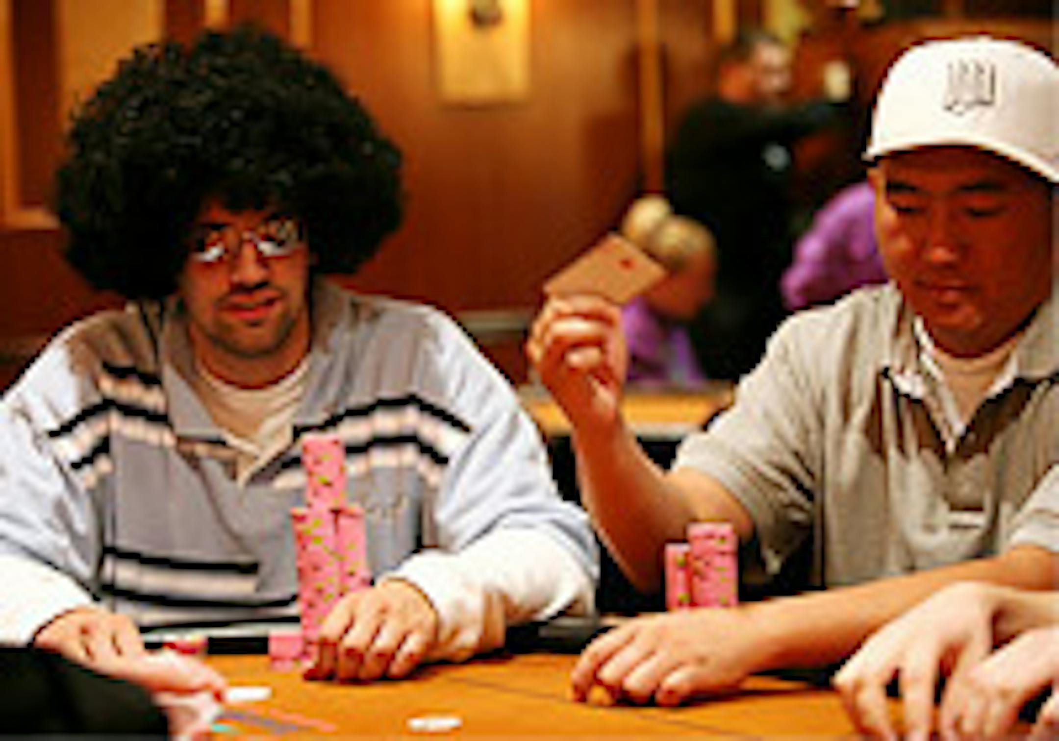 Mark Conroy, left, and Thong Thao, 28, of St. Paul, played poker last Friday at Treasure Island. That's one game Mystic Lake doesn't offer.