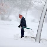 Gerard Langer braved the heavy and blowing snow to shovel in St. Cloud, MN, Friday, November 18, 2016.