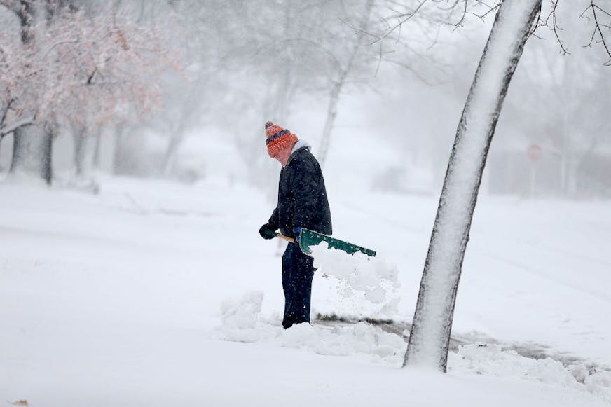 Gerard Langer braved the heavy and blowing snow to shovel in St. Cloud, MN, Friday, November 18, 2016.