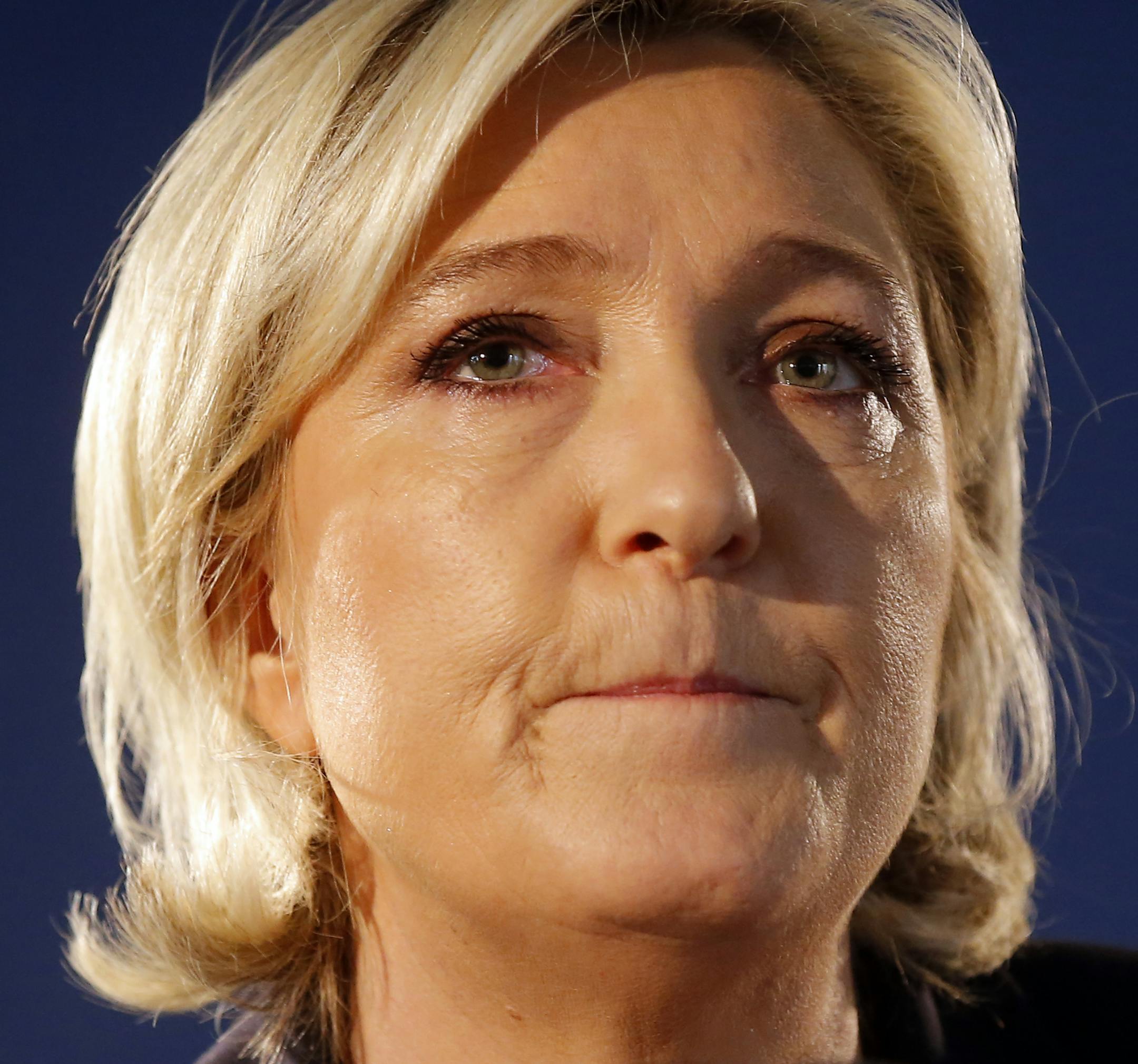 Far-right leader and candidate for the presidential election Marine Le Pen speaks in Paris, Friday, April 21, 2017, one day after the attack that killed one police officer and wounded three other people. Le Pen campaigns against immigration and Islamic fundamentalism. (AP Photo/Michel Euler)