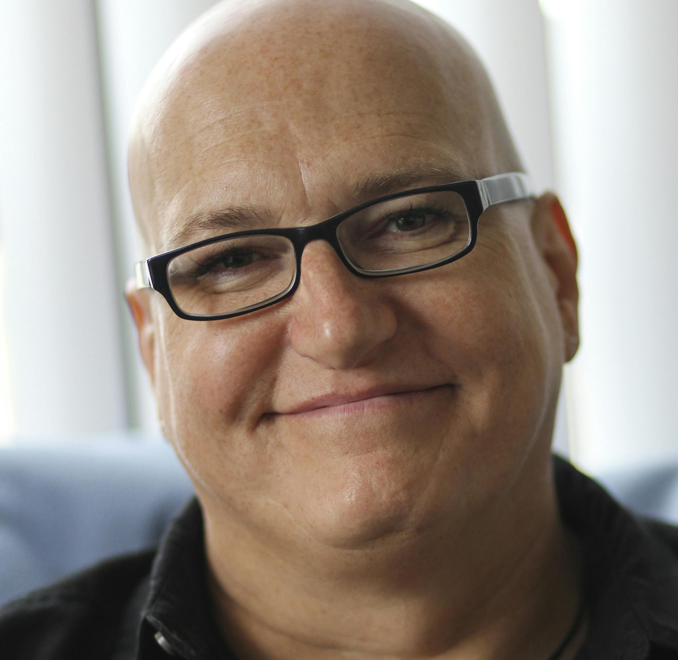 Tim Walker at his residence Saturday, June 8, 2013, in St. Paul, MN.](DAVID JOLES/STARTRIBUNE) djoles@startribune.com Tim/Kimberly Walker, a dual-gender person who lives and works under both identities (using a two-sided business card.**Tim Walker,cq