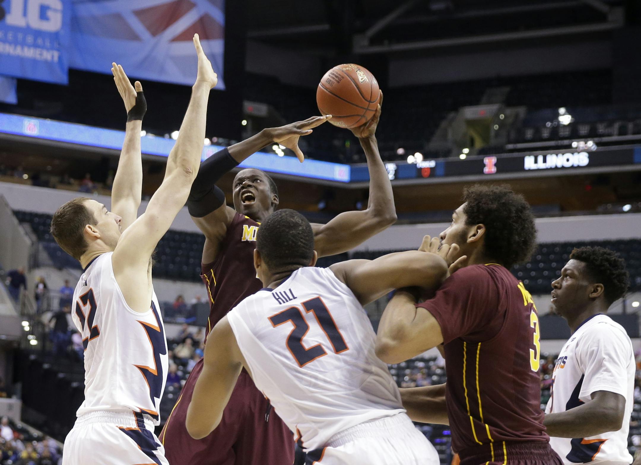 Minnesota’s Bakary Konate (21) goes up for a shot against Illinois' Maverick Morgan (22) in the second half of an NCAA college basketball game at the Big Ten Conference tournament, Wednesday, March 9, 2016, in Indianapolis. (AP Photo/Michael Conroy)