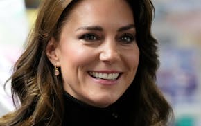 FILE - Kate, Princess of Wales, smiles as she speaks to a woman during her visit to Sebby's Corner in north London, Friday, Nov. 24, 2023. (AP Photo/F