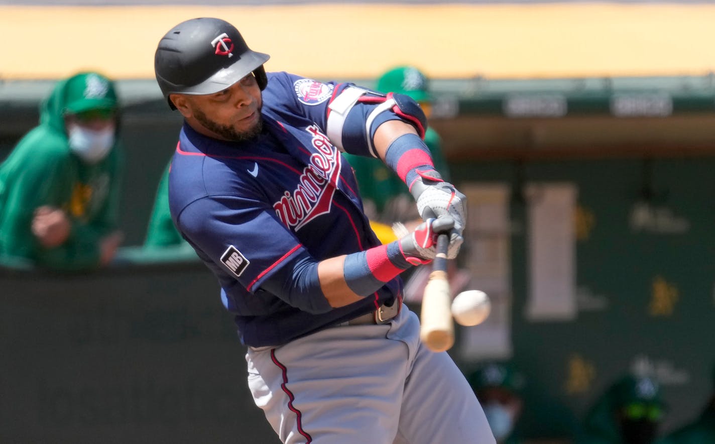 Nelson Cruz hits a solo run home run against Oakland Athletics during the fifth inning - one of two he hit on the day in a losing effort.