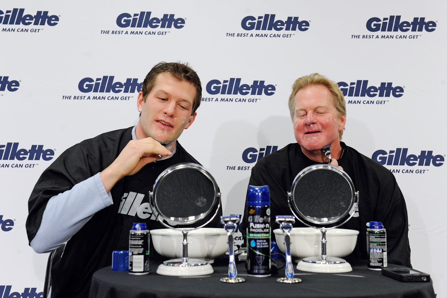 IMAGE DISTRIBUTED FOR GILLETTE - Like father, like son: Ryan Suter, left, Minnesota Wild defenseman and Gillette's U.S. athlete ambassador for the 2014 Olympic Winter Games, participates in a ceremonial shave and send-off to Sochi with his father, 1980 Olympic Gold medalist Bob Suter on Wednesday, Feb. 5, 2014 in St. Paul, Minn. (Photo by Craig Lassig/Invision for Gillette/AP Images)