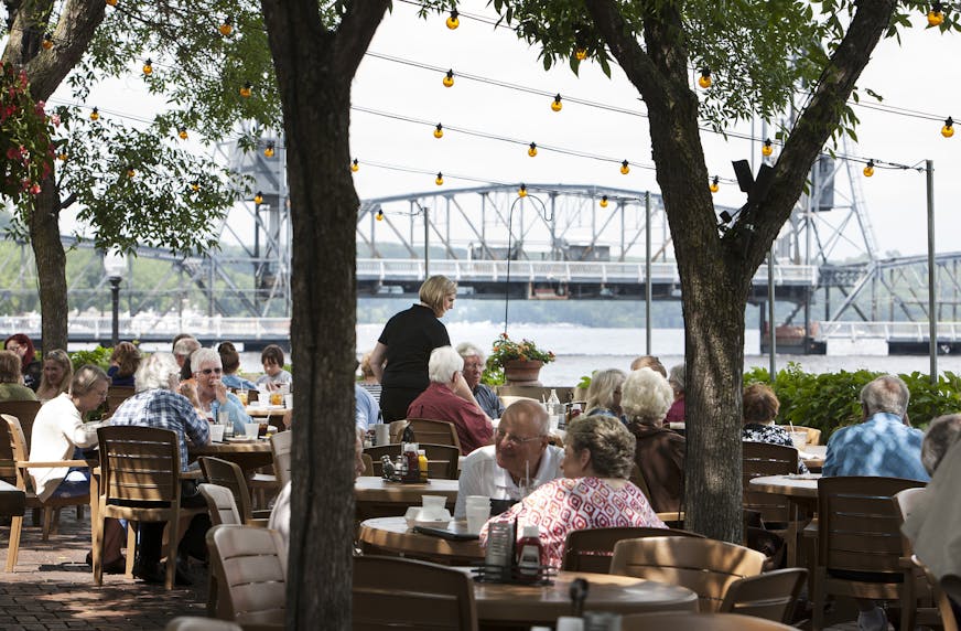 Guests dine on the patio overlooking the St. Croix River at Dock Cafe in Stillwater June 26, 2014. (Courtney Perry/Special to the Star Tribune)