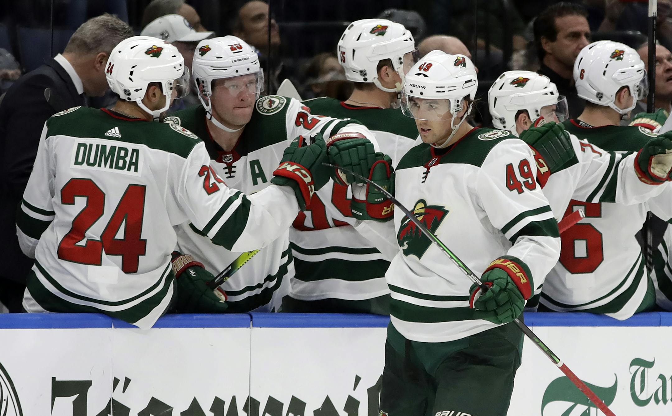 Minnesota Wild center Victor Rask (49) celebrates with the bench after his goal against the Tampa Bay Lightning during the second period of an NHL hockey game Thursday, Dec. 5, 2019, in Tampa, Fla. (AP Photo/Chris O'Meara)
