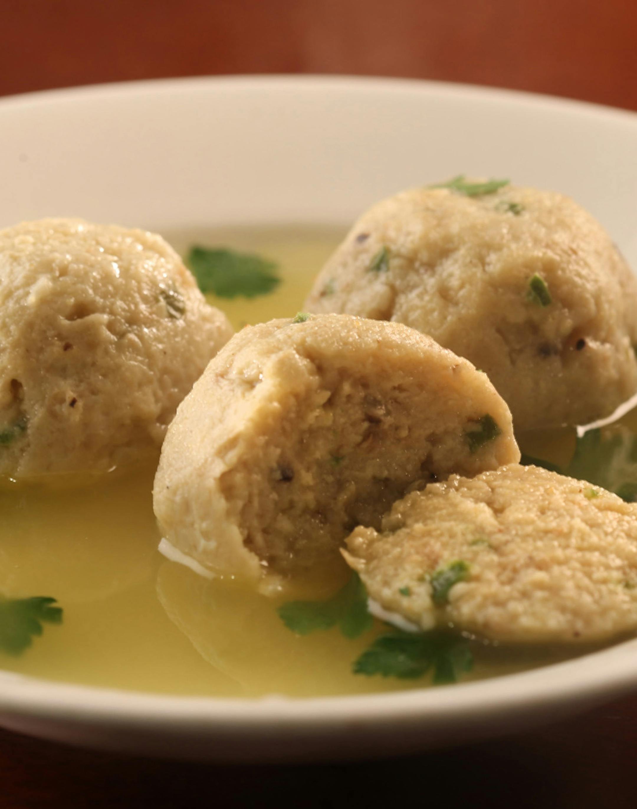 Finely chopped jalapeno brings a bit of unexpected heat to matzo balls for Passover menus. (Corrine Kozlak/food styling.) Abel Uribe/Chicago Tribune ORG XMIT: 2421746