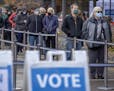 Voters stood in line waiting to cast their early votes at the elections and voters services building on 980 Hennepin Ave. East, Friday, October 16, 20