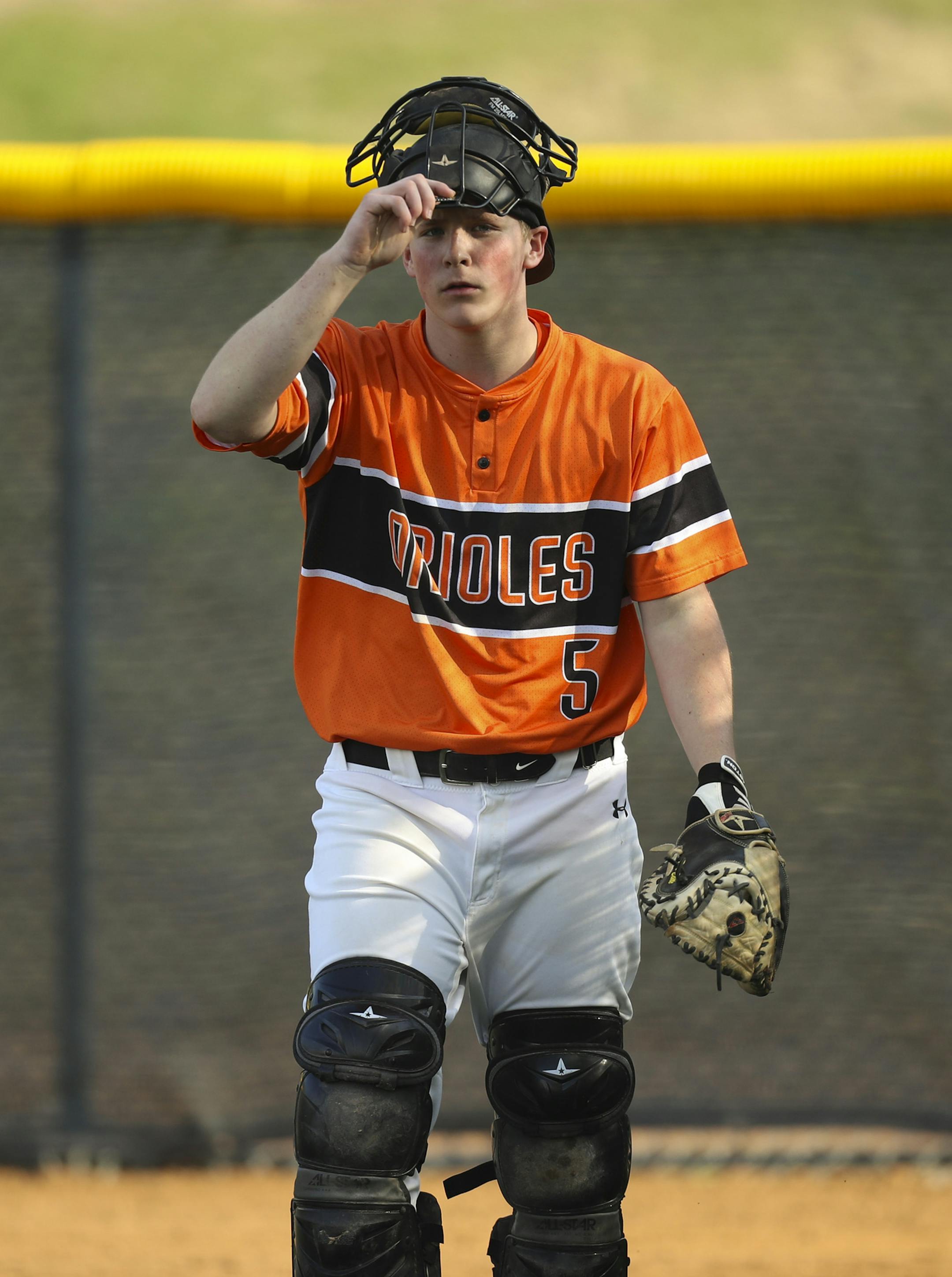 St. Louis Park catcher Sam Hunt headed to the dugout after he caught for pitcher Anthony Odens in the bullpen during the first game of the doubleheader. ] JEFF WHEELER ï jeff.wheeler@startribune.com Chaska hosted St. Louis Park in a doubleheader baseball game Wednesday evening, May 9, 2018 at the Chaska Athletic Park.