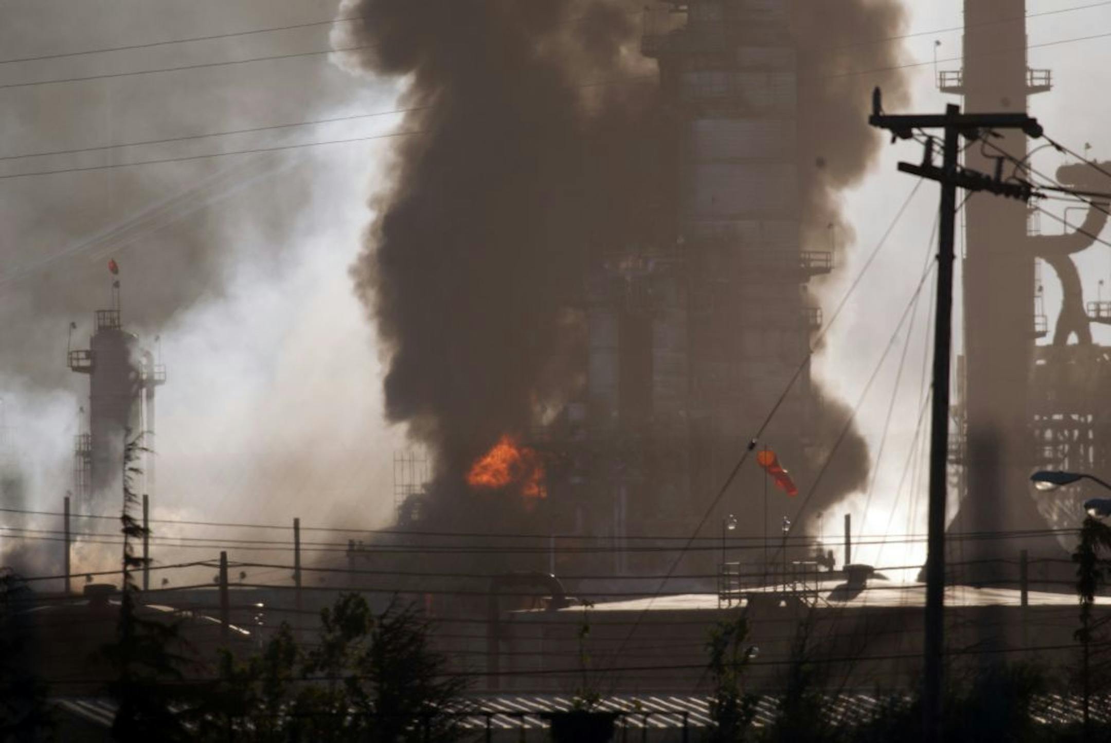 Smoke billows from a crude oil unit at the Chevron refinery in Richmond, California, Monday, August 6, 2012.