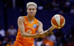 Connecticut Sun guard Natisha Hiedeman passes the ball to a teammate during the second half of a WNBA basketball game against the Phoenix Mercury Wedn