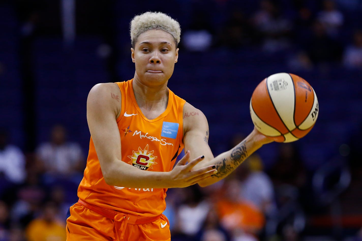 Connecticut Sun guard Natisha Hiedeman passes the ball to a teammate during the second half of a WNBA basketball game against the Phoenix Mercury Wednesday, Aug. 14, 2019, in Phoenix. (AP Photo/Ross D. Franklin)