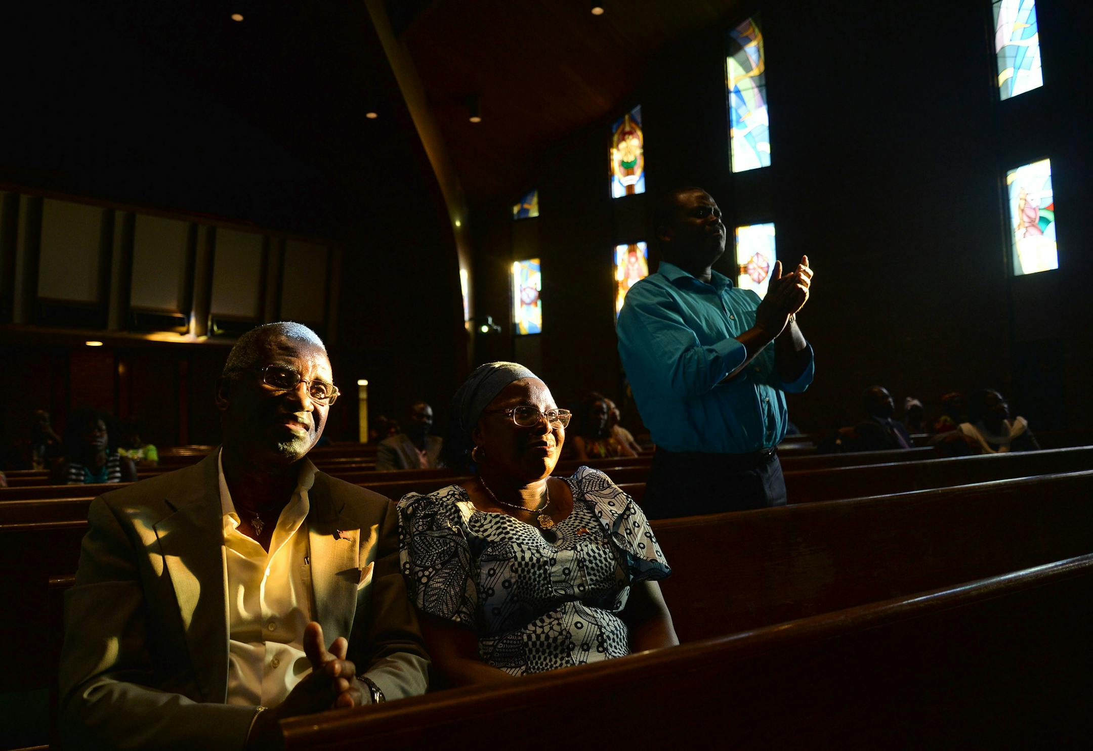 From left, Reyford and Marie Hayes smiled at the conclusion of "the message" given by the keynote speaker at the Liberian 168th Independence Day celebration and "Ebola Thanksgiving & Intercessory Prayer Service" in Brooklyn Center, Minn., on Sunday July 26, 2015. ] RACHEL WOOLF · rachel.woolf@startribune.com