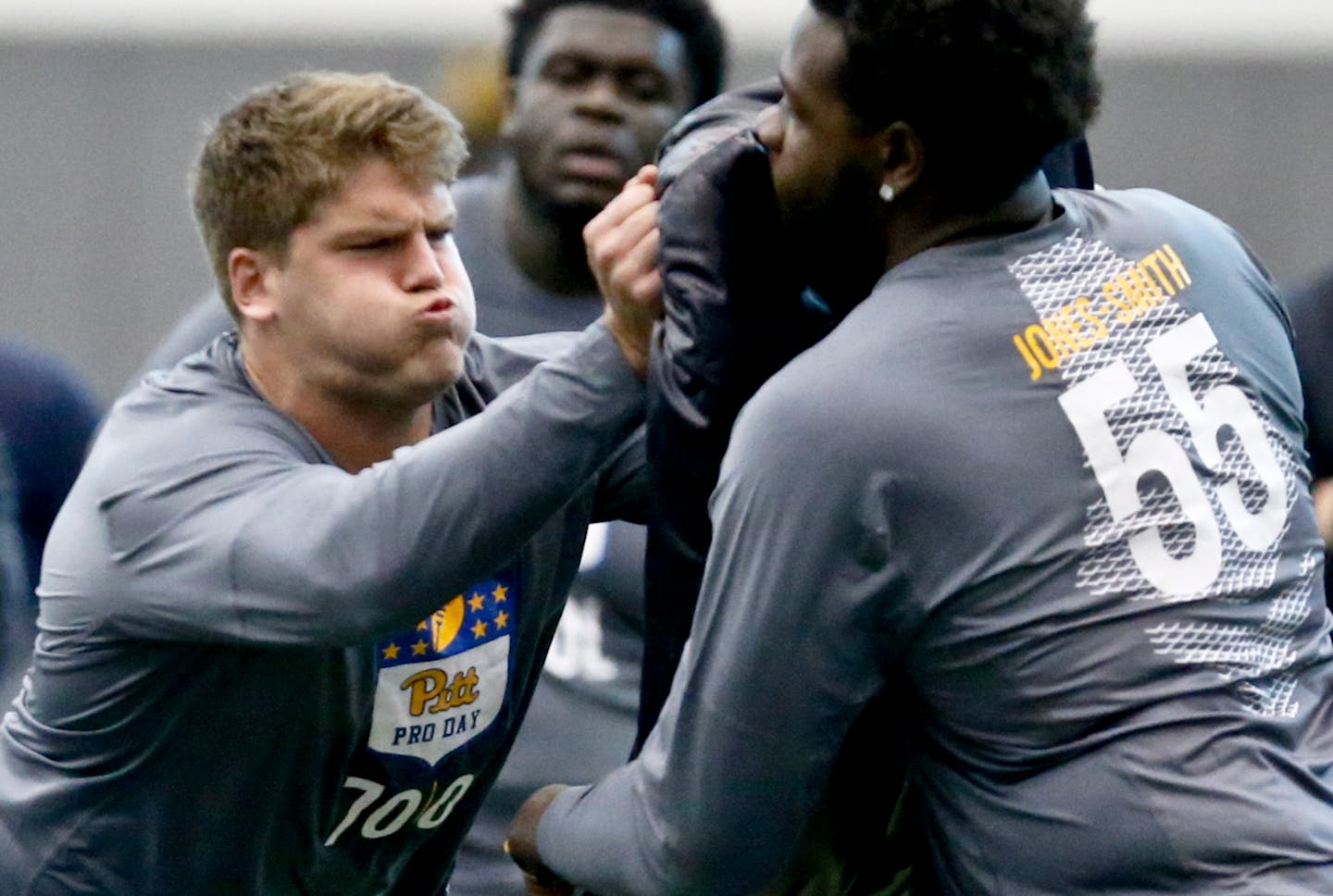 Pittsburgh offensive lineman Brian O'Neill, left, goes through a drill with fellow lineman Jaryd Jones-Smith during an NCAA pro-day