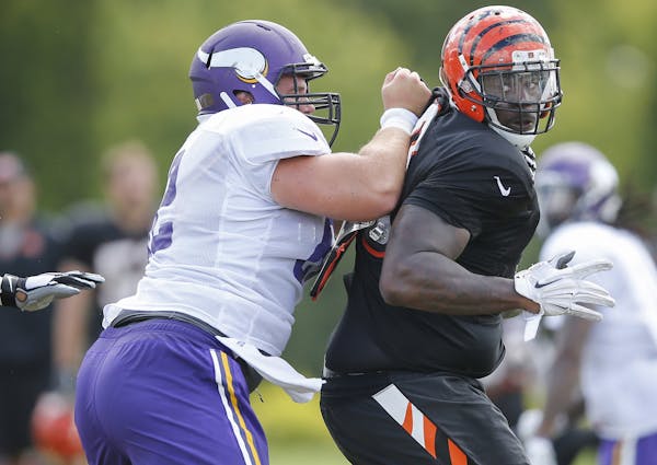 Bengals defensive tackle DeShawn Williams, right, tried to spin past Vikings center Nick Easton during their teams' joint practice last week.